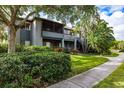 Charming condo exterior featuring lush greenery and a well-maintained walkway at 10263 Gandy N Blvd # 105, St Petersburg, FL 33702