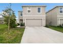 Charming two-story home featuring a two-car garage and well-maintained front yard at 16126 Sunday Stroll Way, Odessa, FL 33556