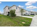 Well-maintained home showcasing a lush lawn, driveway, and tidy landscaping at 16126 Sunday Stroll Way, Odessa, FL 33556