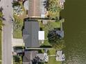 Aerial view of a waterfront home with private dock on deep canal with gulf access and no bridges at 2146 Society Dr, Holiday, FL 34691