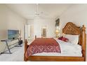 Spacious main bedroom featuring a ceiling fan and neutral carpeting at 2250 Long View Cir, Brooksville, FL 34604