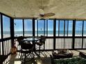 Enjoy ocean views from the screened-in patio featuring comfortable seating, ceiling fan and calming sea breezes at 18304 Gulf Blvd # 217, Redington Shores, FL 33708