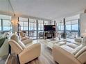 Relax in this light and bright living room with floor to ceiling windows and patio access at 18304 Gulf Blvd # 217, Redington Shores, FL 33708