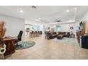 Spacious open-concept living room featuring tile floors and recessed lighting at 32231 Conchshell Sail St, Wesley Chapel, FL 33545