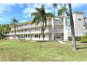 Desirable condo building offering multi-level balconies and a beautifully landscaped lawn at 960 Virginia St # 205, Dunedin, FL 34698
