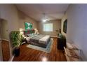 Serene main bedroom with a hardwood floor, ample natural light, and a soothing color palette for relaxation at 12139 Buffington Ln, Riverview, FL 33579
