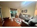 Comfortable living room features modern decor, plush seating, and a sliding glass door at 12139 Buffington Ln, Riverview, FL 33579