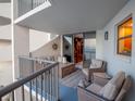 Cozy balcony featuring comfortable wicker furniture and ocean views at 1600 Gulf Blvd # 512, Clearwater, FL 33767