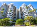 Modern condominium building with manicured landscaping and palm trees at 1600 Gulf Blvd # 512, Clearwater, FL 33767