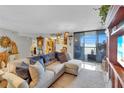 Cozy living room showcasing stylish furnishings, a plush sectional, and ocean views at 1600 Gulf Blvd # 512, Clearwater, FL 33767