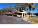 Assigned covered parking space protecting vehicles from the elements with easy access to the building at 2612 Pearce Dr # 211, Clearwater, FL 33764