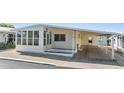 Charming home with a covered carport for convenient parking and easy access at 37838 Granada Ave, Zephyrhills, FL 33541