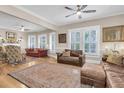 An inviting living room showcasing hardwood floors, ample natural light, and traditional decor at 732 Oak Ne St, St Petersburg, FL 33701