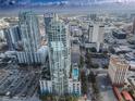 Expansive aerial view of luxury high-rise apartments, showcasing city skyline views and rooftop pool at 777 N Ashley Dr # 1915, Tampa, FL 33602