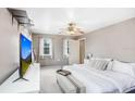 Bedroom with a ceiling fan, a large window, and neutral decor and a TV on the wall at 11050 Revell Rd, Duette, FL 34219
