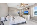 Bright bedroom with a ceiling fan, a large window, and neutral decor at 11050 Revell Rd, Duette, FL 34219