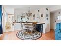 A dining area with a round table under an elegant chandelier at 2370 Jamaican St # 30, Clearwater, FL 33763