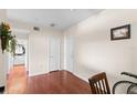 Hallway features hardwood floors and neutral walls, connecting different areas at 501 Knights Run Ave # 1310, Tampa, FL 33602