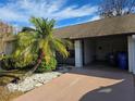 The carport is number 1606 and features a table and chairs for a relaxing outdoor space at 1606 Comfy Ct, Sun City Center, FL 33573