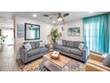 Bright living room with modern sofas, accent pillows, and a decorative coffee table at 2011 1St St, Indian Rocks Beach, FL 33785
