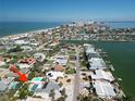 Waterfront neighborhood featuring a lovely home with a private pool and lush landscaping near the beach at 2504 Bayshore Dr, Belleair Beach, FL 33786