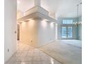 Light and airy living room featuring recessed lighting, neutral walls, tile flooring, and French doors at 2725 Onizuka Ct, Palm Harbor, FL 34683