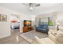 Comfortable living room showcases the open floor plan leading to the bedroom, enhancing the sense of space at 2757 Countryside Blvd # 103, Clearwater, FL 33761