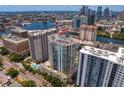 An aerial view showcasing a modern high-rise building and the cityscape at 450 Knights Run Ave # 1704, Tampa, FL 33602