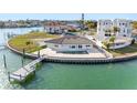 Charming waterfront home with private dock and pool surrounded by manicured landscaping at 11005 5Th E St, Treasure Island, FL 33706