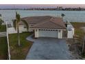 Beautiful single-story home featuring a two-car garage, well-maintained lawn, and fenced yard at 11005 5Th E St, Treasure Island, FL 33706