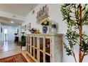 Inviting foyer with a decorative cabinet, neutral walls, and tiled floors at 1718 Golfview Dr # 1718, Tarpon Springs, FL 34689