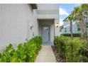 Charming walkway leading up to the covered front door at 36419 Garden Wall Way, Zephyrhills, FL 33541