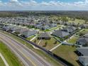 An aerial view highlights the home's position in a Gathering-friendly neighborhood near green spaces and a golf course at 4043 Salida Del Sol Dr, Sun City Center, FL 33573