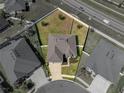 This aerial perspective showcases a beautiful property featuring a well-maintained lawn and neighborhood streets at 4043 Salida Del Sol Dr, Sun City Center, FL 33573