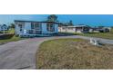Charming single-story home featuring covered parking and an accessible ramp entrance at 196 Philadelphia Blvd # 10, Palm Harbor, FL 34684