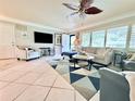 Cozy living room features tile flooring, natural light, and comfortable seating, perfect for relaxation at 6398 17Th N Pl, St Petersburg, FL 33710