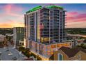 Modern high-rise building with a sleek design and vibrant rooftop lighting at sunset at 777 3Rd N Ave # 805, St Petersburg, FL 33701