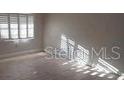 Bright bedroom with ample natural light from the windows, showcasing a serene living space at 10033 64Th N Ave # 9, St Petersburg, FL 33708