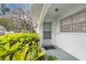 Inviting entrance to the house, featuring a well-maintained doorway and manicured plants at 11200 102Nd Ave # 16, Seminole, FL 33778