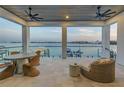 Spacious balcony showcasing panoramic water views and comfortable seating at 201 Punta Vista Dr, St Pete Beach, FL 33706