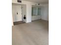 Inviting living room featuring a large open space and a convenient storage cabinet at 2413 Bayshore Blvd # 205, Tampa, FL 33629