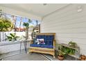Cozy wicker sofa with decorative pillows on a covered front porch at 2721 12Th N St, St Petersburg, FL 33704