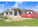 New construction home featuring a modern design with large windows and a spacious layout at 31049 Eloian Dr, Wesley Chapel, FL 33545