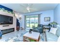 The living room features a fireplace and a sliding glass door that leads to the backyard at 32960 Regent Canal St, Wesley Chapel, FL 33545