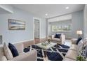Comfortable living room with elegant furnishings, a plush rug, and serene artwork, creating a relaxing atmosphere at 3620 E Shadowlawn Ave, Tampa, FL 33610
