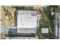 Birds eye view of a well-maintained single story home with a driveway, shed and awning at 36936 Kay Ave, Zephyrhills, FL 33542