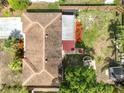 Aerial view of the house showing roof, backyard with firepit and covered patio at 5985 38Th N Ave, St Petersburg, FL 33710
