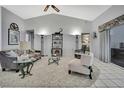 Bright living room features high ceilings, tile floors, and is decorated with modern furniture at 8045 Sugarbush Dr, Spring Hill, FL 34606