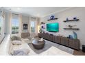 Stylish living room with a comfortable white sectional, wood floors, and tasteful decor at 19915 Gulf Blvd # 704, Indian Shores, FL 33785