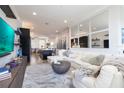 Inviting living room with open layout to kitchen and dining area, featuring modern furnishings at 19915 Gulf Blvd # 704, Indian Shores, FL 33785